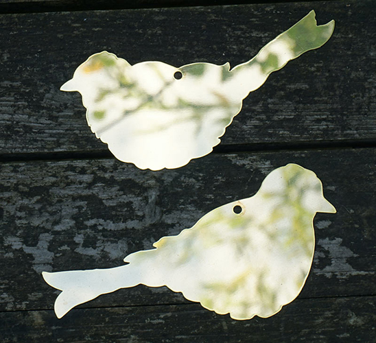 brass bird and leaf plaques