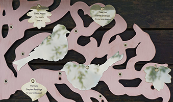 Brass leaf and bird plaques on copper memory tree by Finch Tree UK